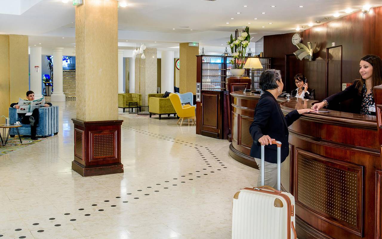 Arrivals of our customers at the reception with lounge and with available and smiling staff, trip to lourdes, Hotel La Solitude.